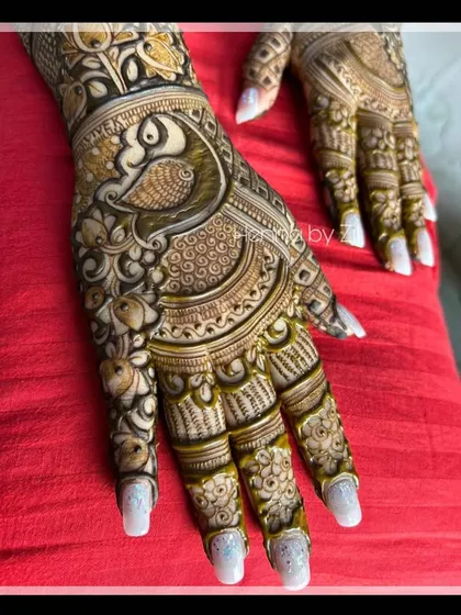 A close-up of a stunning peacock design, showing the detailed feather work and shading.