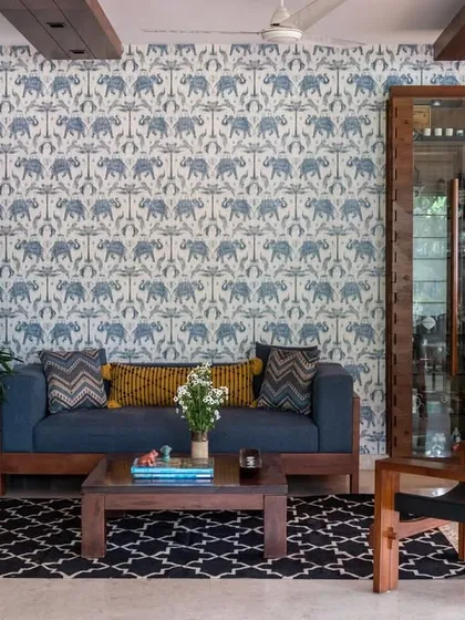 Showcasing our versatility, this Boho-Desi bar and lounge blends modern silhouettes with Indian soul. The vibrant, elephant-patterned wallpaper, jute-carved floors, and eclectic textiles create a space that is a melody of contrasts. It’s a perfect example of how we craft unique, personality-filled interiors.
