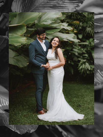 A stylish framed portrait of the couple in a garden, the black and white edit adding a timeless feel.