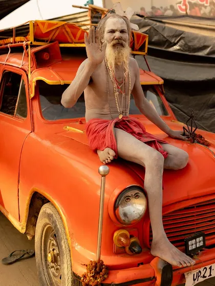 Meet Ambassador Baba, a Naga Saint who has traveled for 35 years in his 1972 Ambassador car. This portrait, taken at the Maha Kumbh Mela, captures his unique story of devotion on the road.