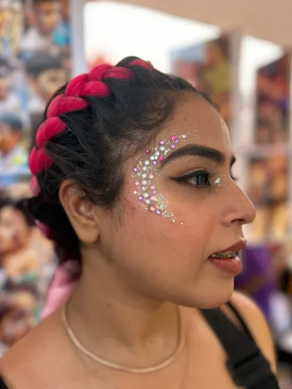 Pink on pink! This glittery design with pink and silver rhinestones was a perfect match for her braided hair. So fun and festive.