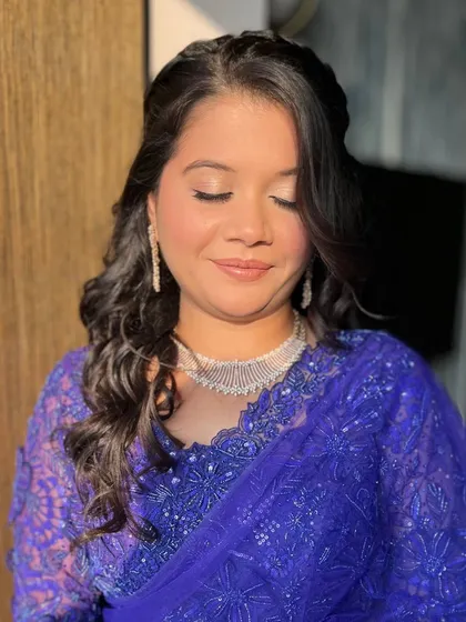 A close-up of the final look from the "understood the assignment" video. The soft glam makeup looks stunning in the warm sunlight.