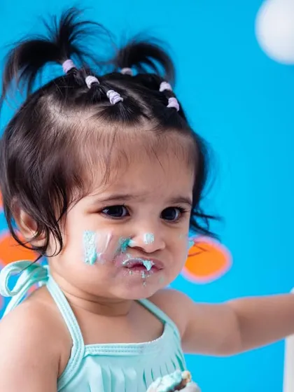 A close up of the messy face. I love capturing these details that show just how much fun they had. The blue frosting is a clear indicator of a good time.