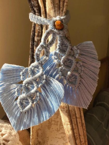 Another look at our macrame leaf curtain tie-backs, catching the beautiful sunlight. These small details can truly elevate the look of a room.