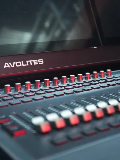 A close-up of the faders and buttons on the new Avolites D7. This console represents the pinnacle of lighting control technology.