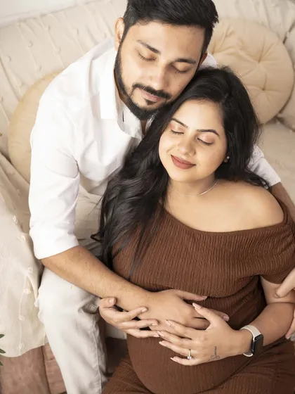 A close-up of the couple embracing, both with eyes closed in a moment of peace. This image is all about the feeling of love and contentment.