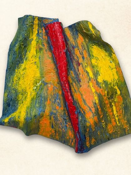 An abstract interpretation of Ganpati, created with thick layers of acrylic paint on a shaped metal base. The bold colors and textures give it a powerful energy.