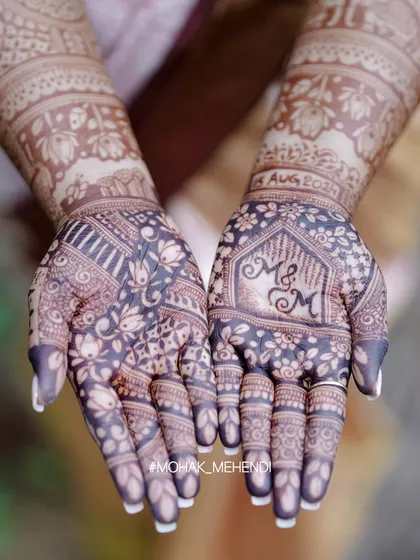 The final result is everything. A deep, rich henna stain is the sign of pure, natural paste and proper technique, something I ensure every student learns to master. This design beautifully incorporates the couple's initials.