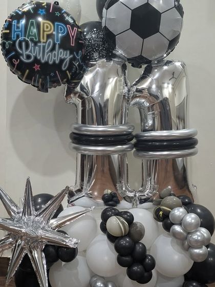 The complete football balloon centerpiece, including a starburst foil balloon, perfect for a sports-loving kid.