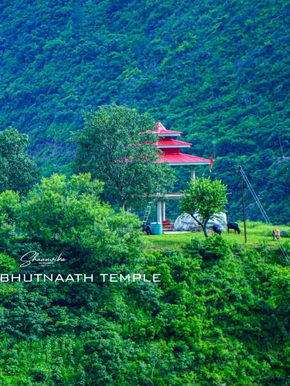 A view of the Kawanti Bhutnaath temple nestled in the lush green hills. This shot captures the serene environment and how the temple is a natural part of the surrounding landscape.