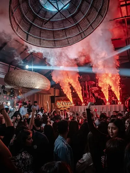 The party in full swing at De'orra, with CO2 cannons and spotlights creating a festival atmosphere.