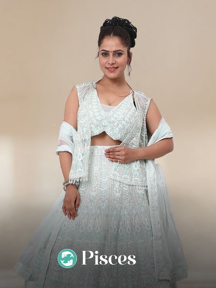 Pisces, you are a dreamer. This light green lehenga with a modern jacket gives off the ethereal and romantic vibe you love.