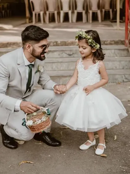 A perfect moment for a little flower girl. I crafted this classic white tulle gown to be both elegant for the ceremony and comfortable enough for her to feel like a cherished part of the special day.