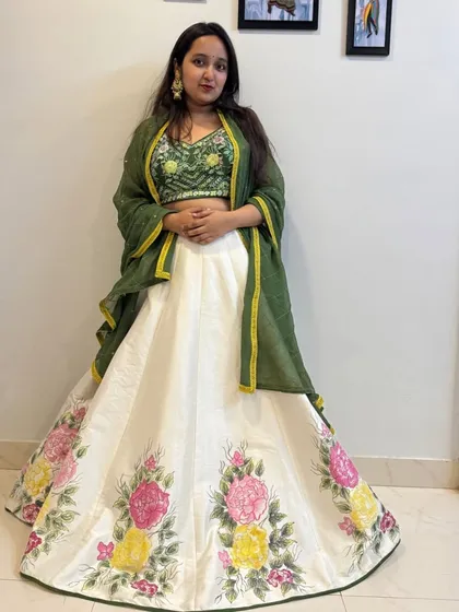 A full-length view that captures the artistic beauty of this hand-painted lehenga set. It's a perfect blend of traditional and contemporary style.