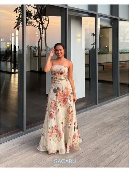 The quintessential summer wedding lehenga. This light and breezy strapless ensemble is crafted from silk organza with a beautiful floral print, perfect for outdoor festivities.
