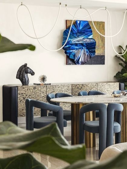 This eclectic dining room by SwitchOver Studio shows how my sculpture can be integrated into a space rich with color, pattern, and texture.