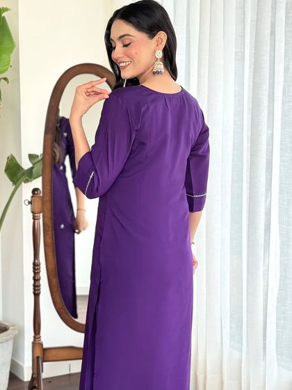 A beautiful violet chanderi viscose kurta set. The thread embroidery and printed dupatta create a look that's both regal and feminine.