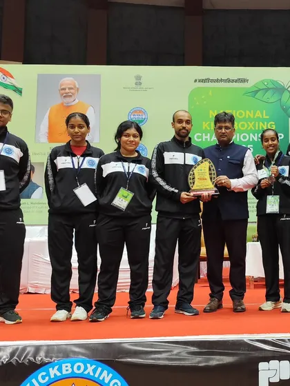 Our Team Legends stands proud after a successful campaign at the Senior Nationals Kickboxing Championship. We are holding the team trophy, a symbol of our collective hard work and dominance in the sport.