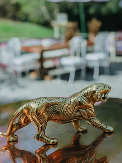 A small, fierce detail. This brass tiger figurine added a touch of wild, royal-inspired charm to a tabletop, reflecting the jungle theme of the celebration.