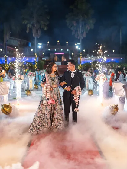 Making a grand entrance at the reception. I use special effects like low-lying fog and sparklers to create a dramatic, cinematic feel for your reception photography, ensuring your entry is as memorable as the ceremony itself.