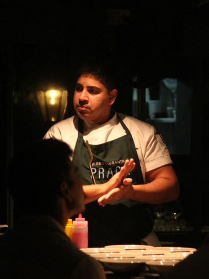 Chef Ralph Prazeres of Praça Prazeres engaging with guests during 'The Wonder Years' dinner, sharing the stories behind their collaborative menu.