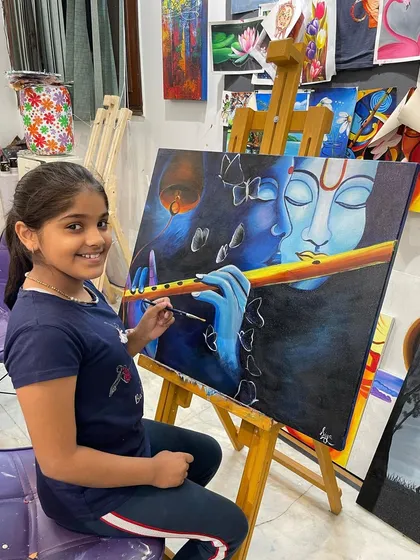It's moments like this that I live for as a teacher. Here is one of my talented young students putting the finishing touches on her large Krishna painting, showing that age is no barrier to creating beautiful art on canvas.