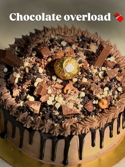 The name says it all: Chocolate Overload. This cake is topped with KitKat bars, Ferrero Rocher, chocolate chips, and a rich chocolate drip for the ultimate indulgence.