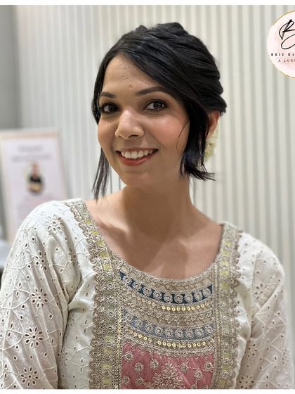 Another look at this classic and elegant updo. It's a versatile style that is perfect for weddings, festivals, or any formal event.