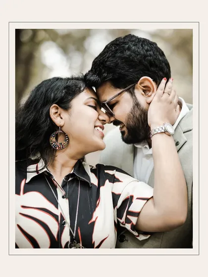 An intimate close-up where the couple's foreheads touch. This shot is all about feeling, capturing the quiet joy and deep affection in their expressions.