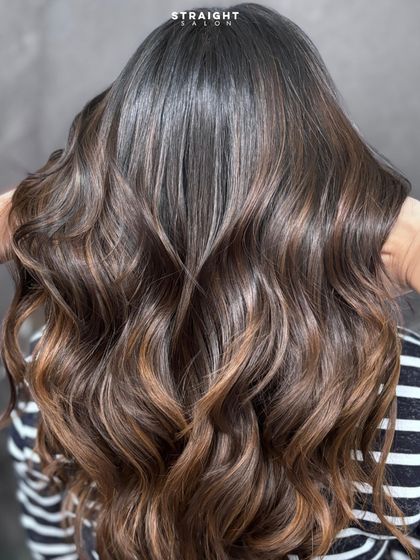 This brunette balayage is the definition of soft glam, with a beautiful gradient from dark to light.