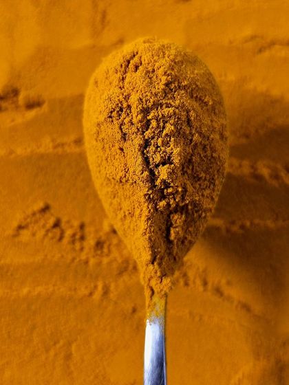 A close-up of turmeric, a cornerstone of Ayurvedic medicine and Indian cooking for millennia.