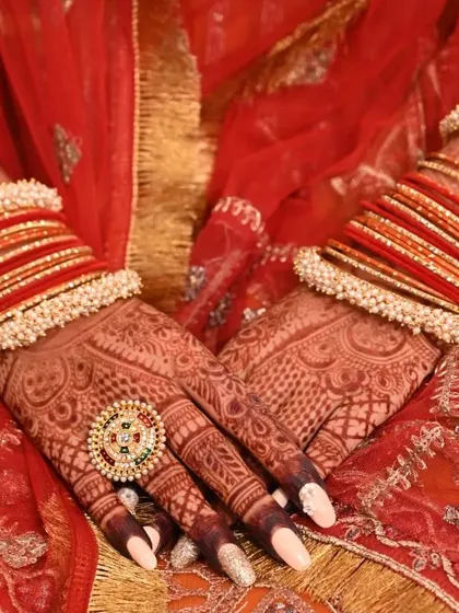This is what it's all about. Seeing my henna art, with its deep and beautiful stain, become a part of a bride's special day, perfectly complemented by her bangles and outfit.