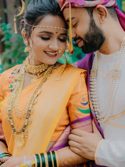This is the kind of moment I live to capture. An intimate, unposed portrait of a Maharashtrian couple, lost in their own world. The delicate mundavalya and traditional jewelry complete the frame.