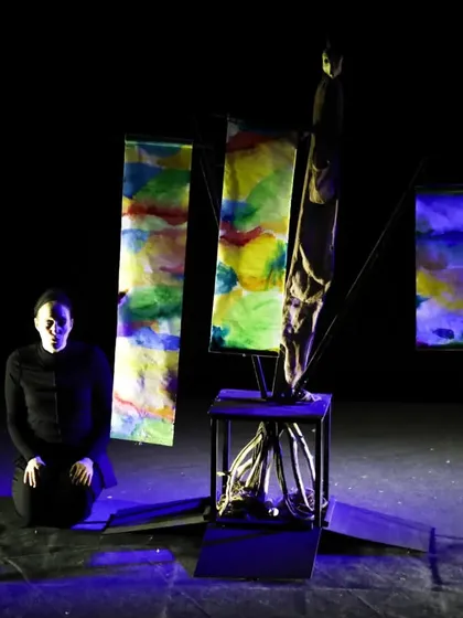 The stage of 'Wings & Roots' is decorated with colourful banners, representing the renewal of life after the great flood in this adaptation of a timeless tale.