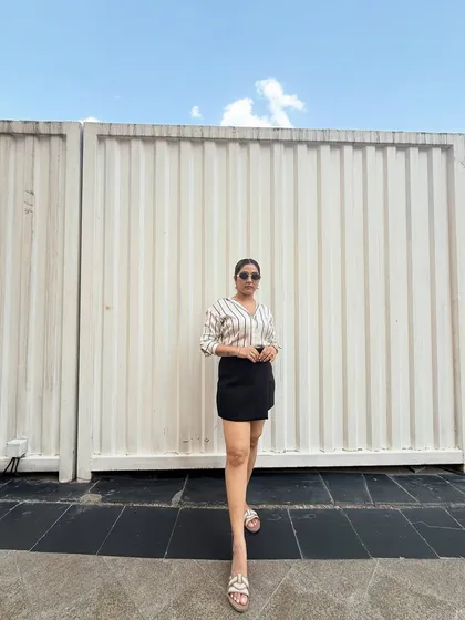 A full-length view showcasing a simple yet effective everyday outfit. My philosophy is to invest in quality basics that you can wear on repeat, ensuring you always have something stylish to wear.
