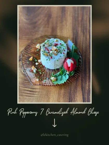I love making a single ingredient the star of the show. Here is my signature Pink Peppercorn and Caramelized Almond Cheese, a housemade creation that is creamy, sweet, and a little bold, garnished with a fresh strawberry.