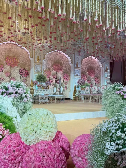 Various angles of the pastel mandap, showcasing the expanse of blooms, the custom seating, the floral aisle, and the intricate details that made this a truly wholesome and majestic celebration.