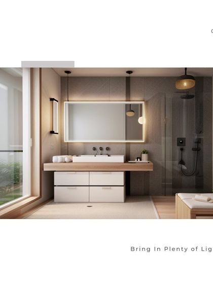 This bathroom is designed to be bright and airy, with a large window letting in plenty of natural light. The floating double vanity, backlit mirror, and glass-enclosed shower contribute to the open and spacious feel.