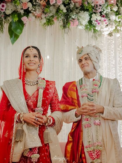 A beautiful portrait of the couple standing together, looking radiant after their wedding ceremony.