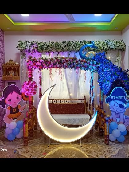 The peacock-themed decor under blue lighting, creating a magical, nighttime feel. The lighting can be adjusted to create various effects.