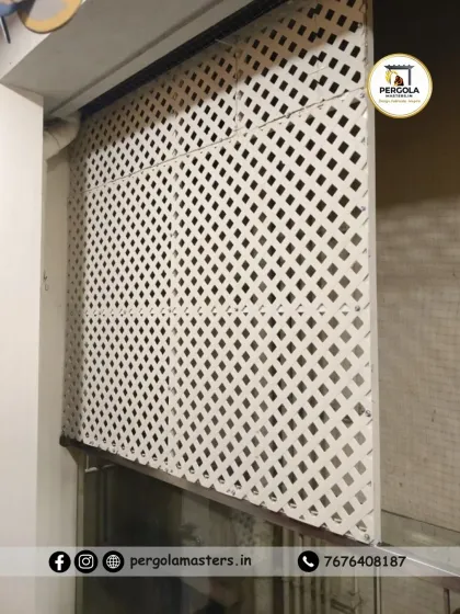 Another view of the white lattice screen installation, showing its clean edges and secure fit within the balcony opening.