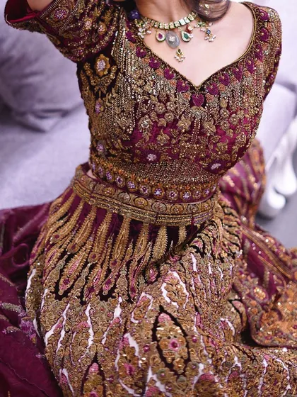A close-up of the intricate embroidery on one of my signature bridal lehengas. Every stitch is a story of tradition and luxury, designed to make your wedding day perfect.