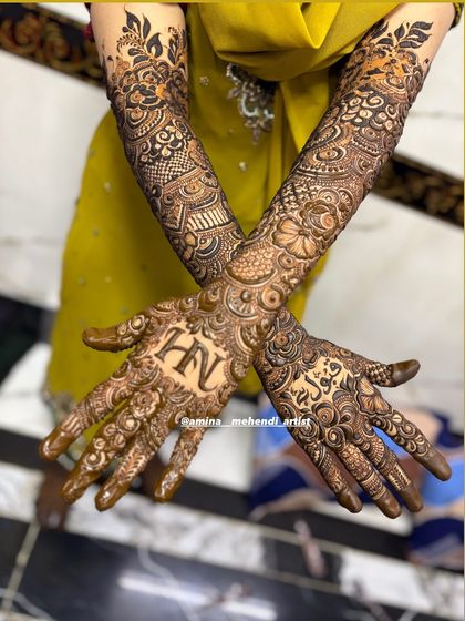 A beautiful crossed-hands pose showing the 'H' and 'N' initials.