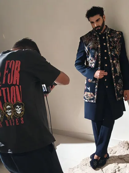 On set with the photographer, capturing the final look. This image shows the collaborative environment of a professional shoot and my role in preparing the model for the camera.