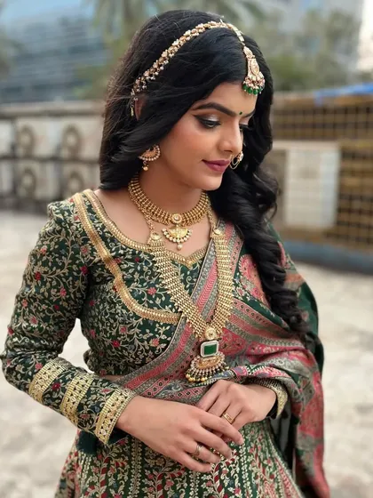 The final result of my seminar demonstration. This subtle yet royal look features soft, defined eyes and a regal green and pink lehenga.