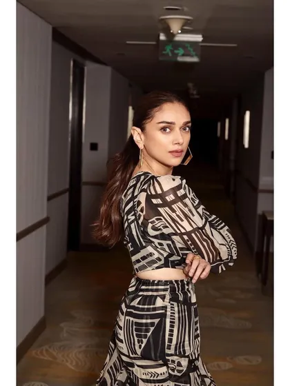 A back view of the one-shoulder printed set, highlighting the unique design and hairstyle.