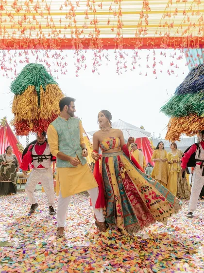 The heart of any celebration is the pure, unscripted joy of the couple. We orchestrate grand entries, like this one with a shower of confetti and performers, to create high-energy moments that become treasured memories.