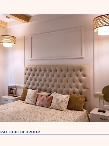 A neutral chic bedroom that exudes calmness. The deeply tufted headboard creates a soft, luxurious focal point, complemented by wall moldings and warm, layered lighting from the woven pendant lamps.