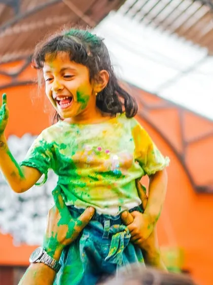 The pure joy of a child at one of my Holi events. My parties are for everyone, and seeing moments like this makes it all worthwhile.