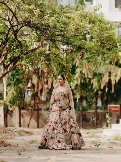 Our chic and minimal bride, Priya, styled virtually for her intimate ceremony in Gujarat. Her floral lehenga is perfect for an outdoor setting, blending tradition with a touch of modern romance.